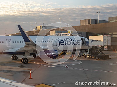 JetBlue Airbus A320 sitting on JFK runway tarmac refueling Editorial Stock Photo